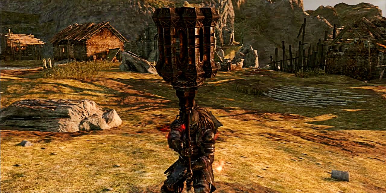 player holding up a massive hammer in majula