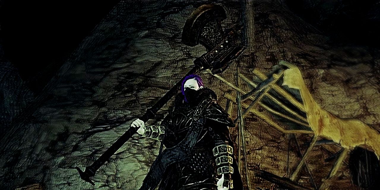greataxe held by the player in a dark cave