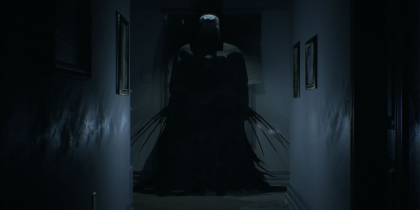 Hooded figure in a hallway