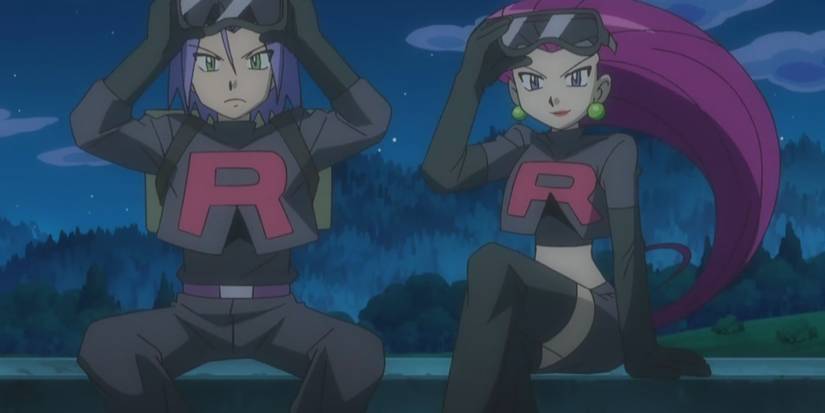 Jessie and James lift off goggles whilst being dressed in all black