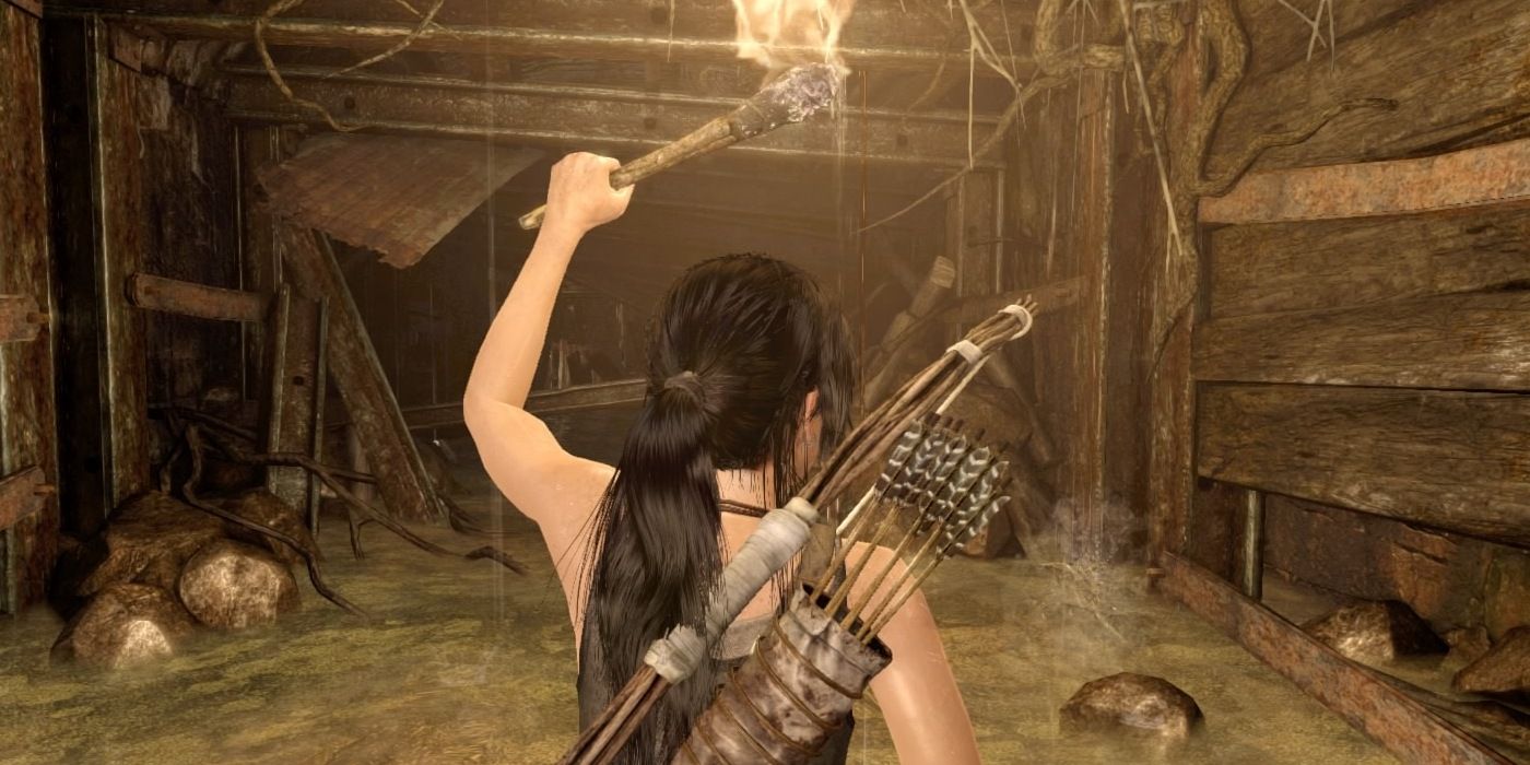 Lara holding a torch