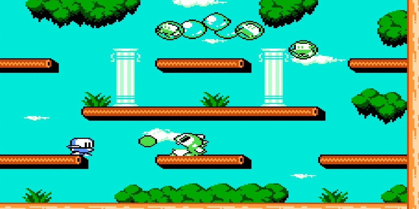 Bubble Bobble Part 2 NES Bub firing bubbles at robot foe at platforming stage daylight