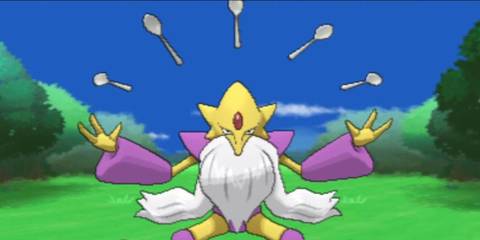 Mega Alakazam in game, raising spoon.