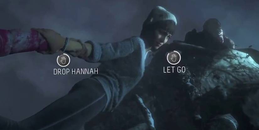 Beth holding Hannah while hanging off cliff.