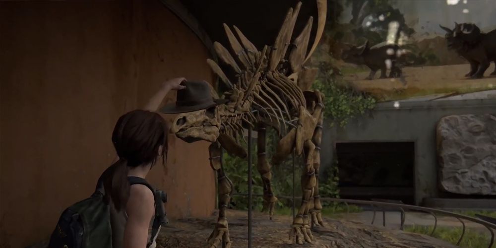 Ellie puts a hat on a dinosaur in the Last of Us Part 2