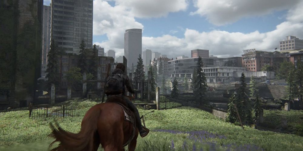 Ellie riding a horse with the Seattle landscape in front of her (The Last of Us Part 2)