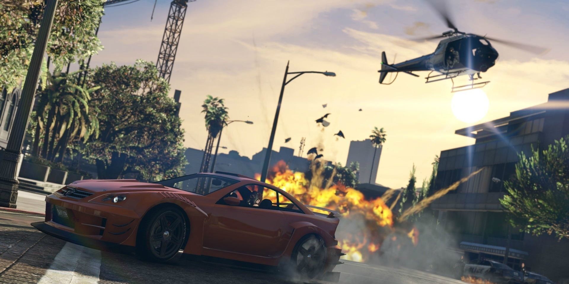 GTAV explosions and car turning on street with chopper above