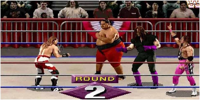 four wrestlers preparing to fight in a ring