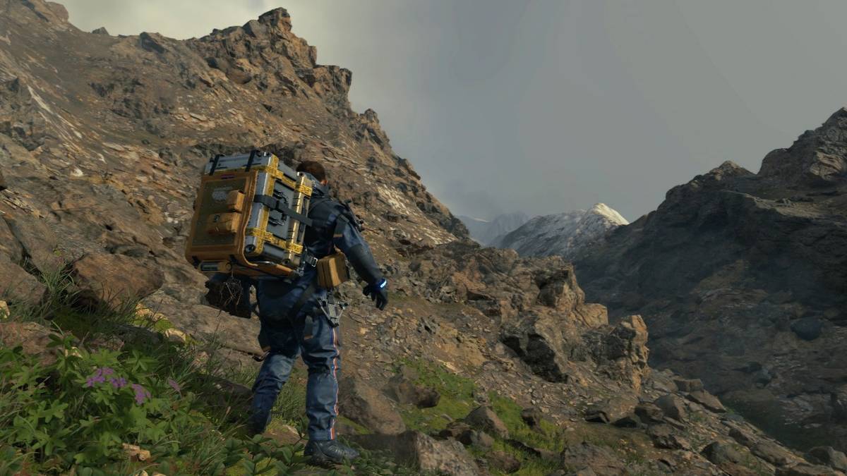 sam on cliff with cargo