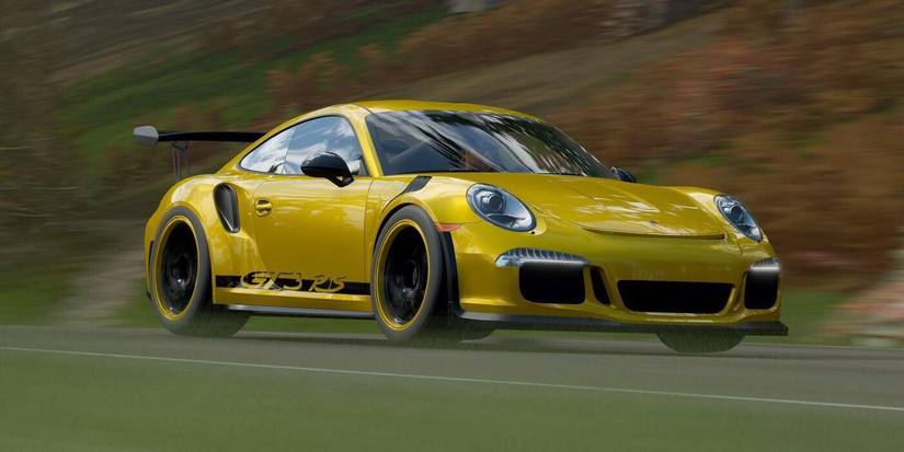 Forza Horizon 4 Porche 911 GT3 RS PO zipping across street in hilly street