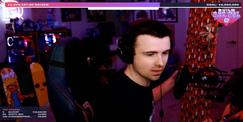 Dr. Lupo holding wrapped gift during St. Jude charity stream.