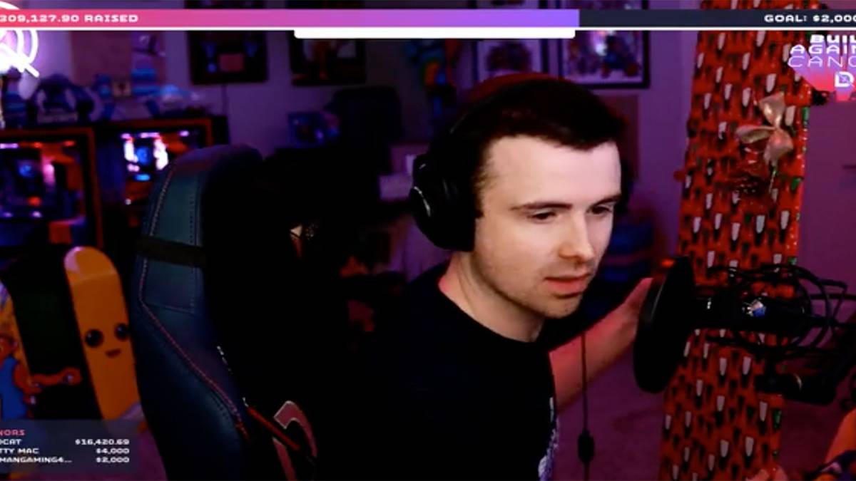 Dr. Lupo holding wrapped gift during St. Jude charity stream.