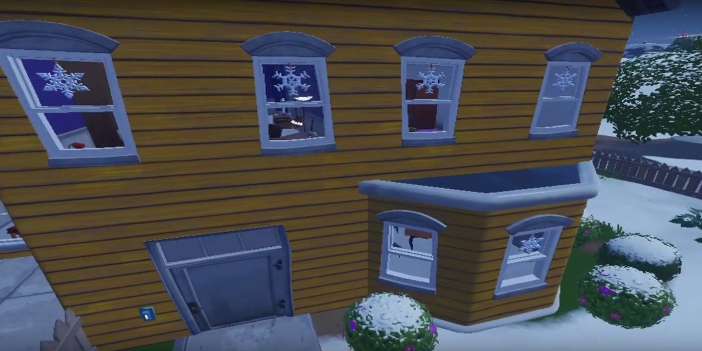 fortnite pleasant park yellow house with snowflake decorations for today's challenge