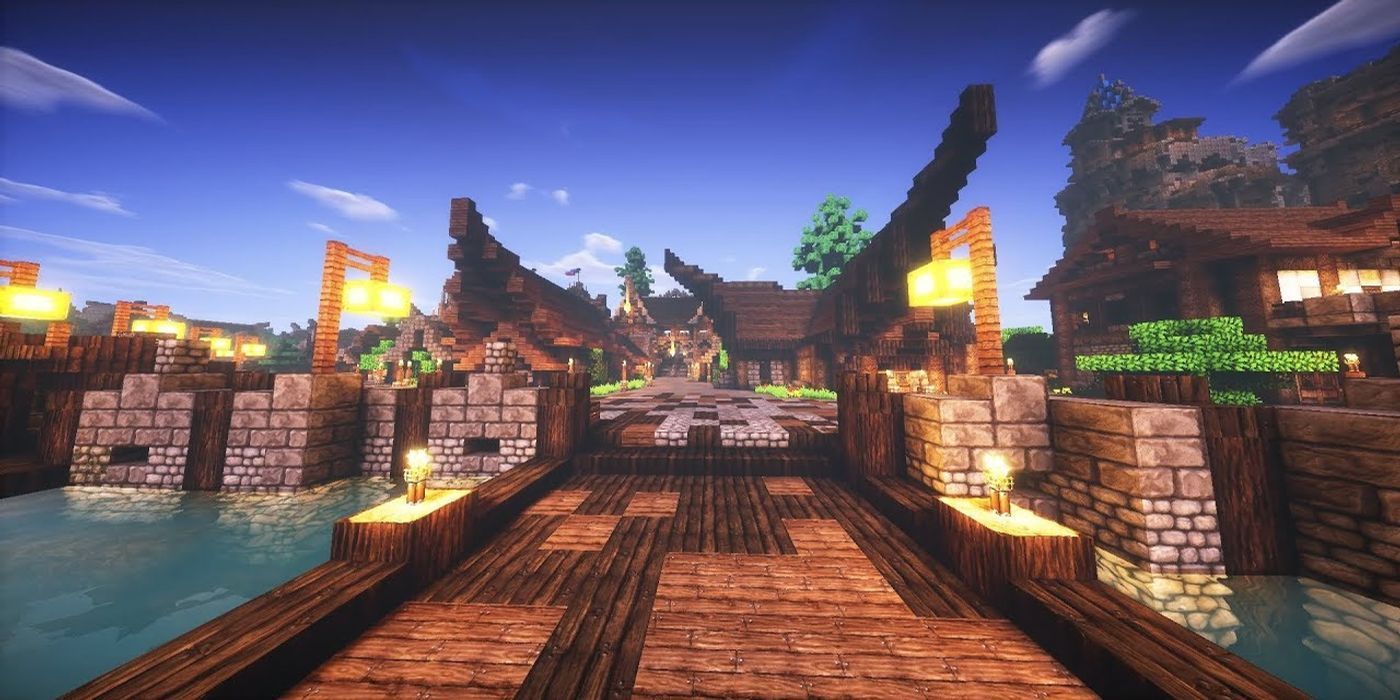 Minecraft Triliton Shaders scenic shot of village and bridge during sunset