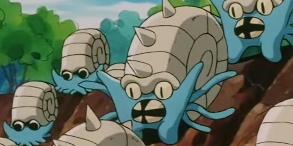 Omanyte and Omastar from Pokemon anime running down mudslide