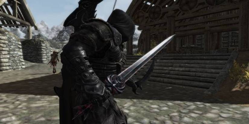Skyrim player holding a sword