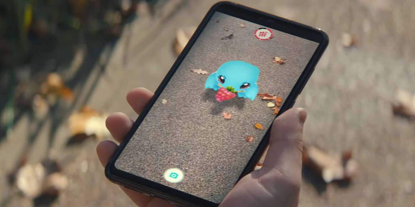 Pokemon Go on phone with Squirtle on screen as a buddy.