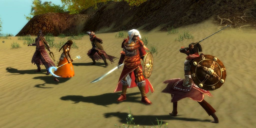 A group of Guild Wars Nightfall characters fighting enemies in the desert