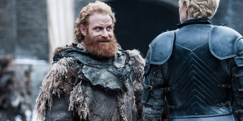 Tormund Giantsbane raising an eyebrow and smiling flirtatiously at Brienne of Tarth in Castle Black