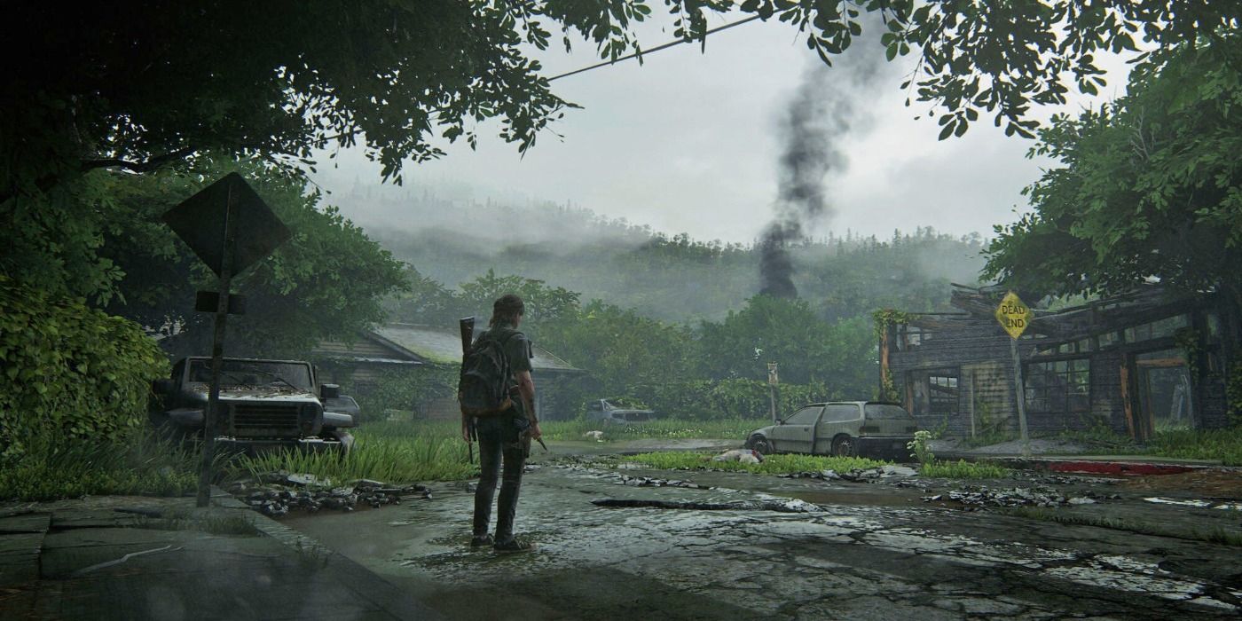 last of us part 2 ellie standing on a road in town