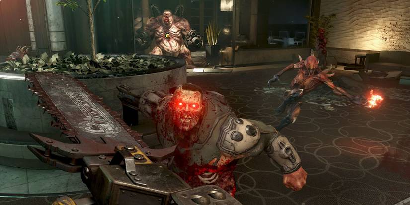 Doom Eternal wielding chainsaw against glowing eyes demon approaching