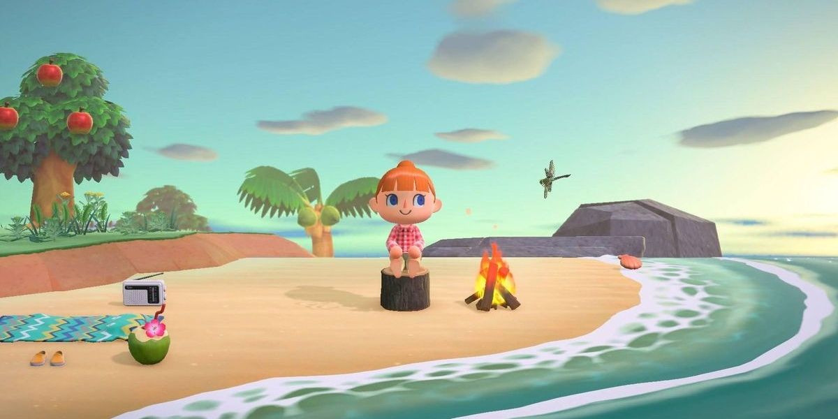 Animal Crossing New Horizons Player Sitting at the beach by campfire