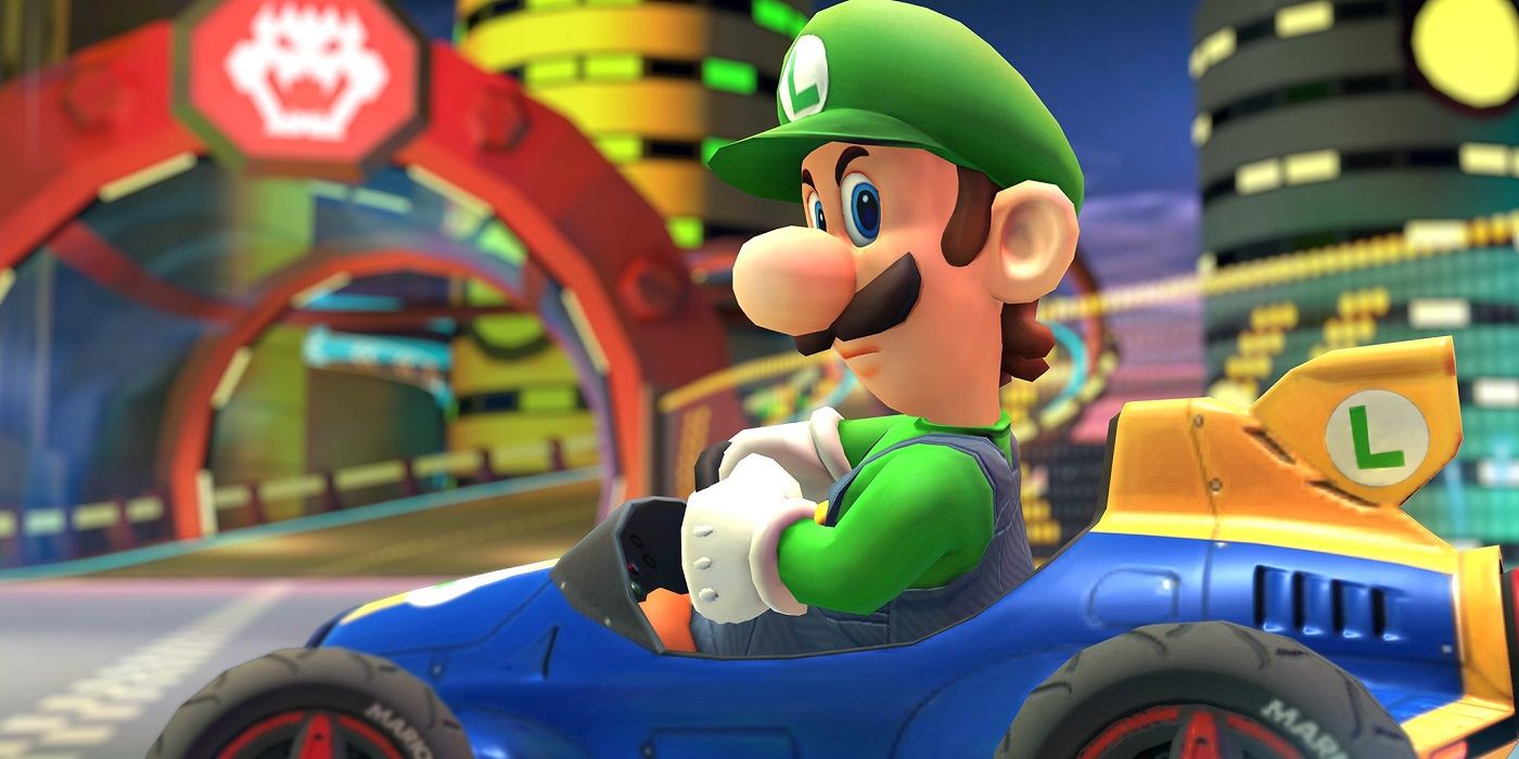 Luigi in a kart looking at the camera