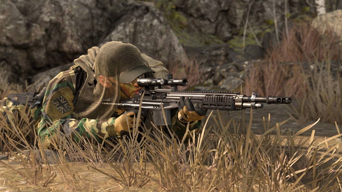 A sniper hiding in the grass.