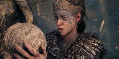 A character holding a ball in Hellblade Senuas Sacrifice
