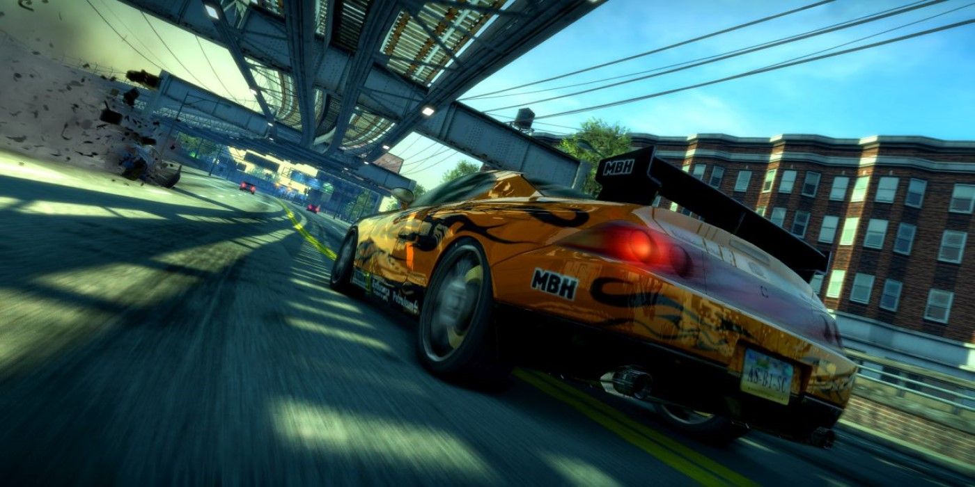 close up back angle view of car speeding under rails in Burnout Paradise Remastered Switch