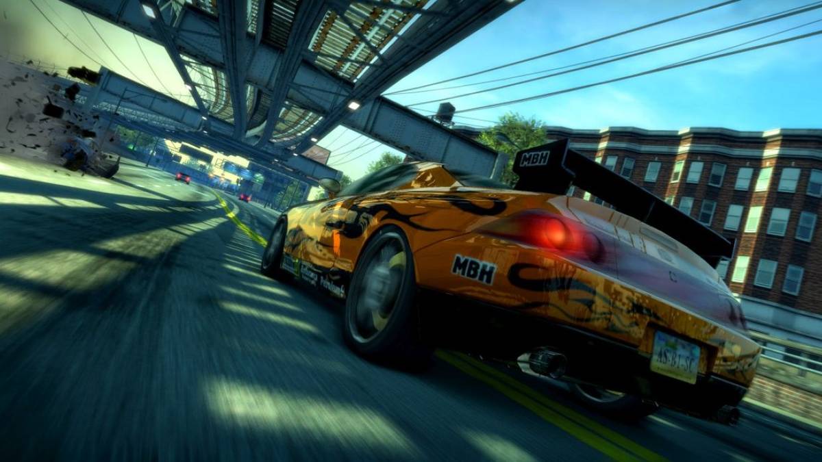 close up back angle view of car speeding under rails in Burnout Paradise Remastered Switch