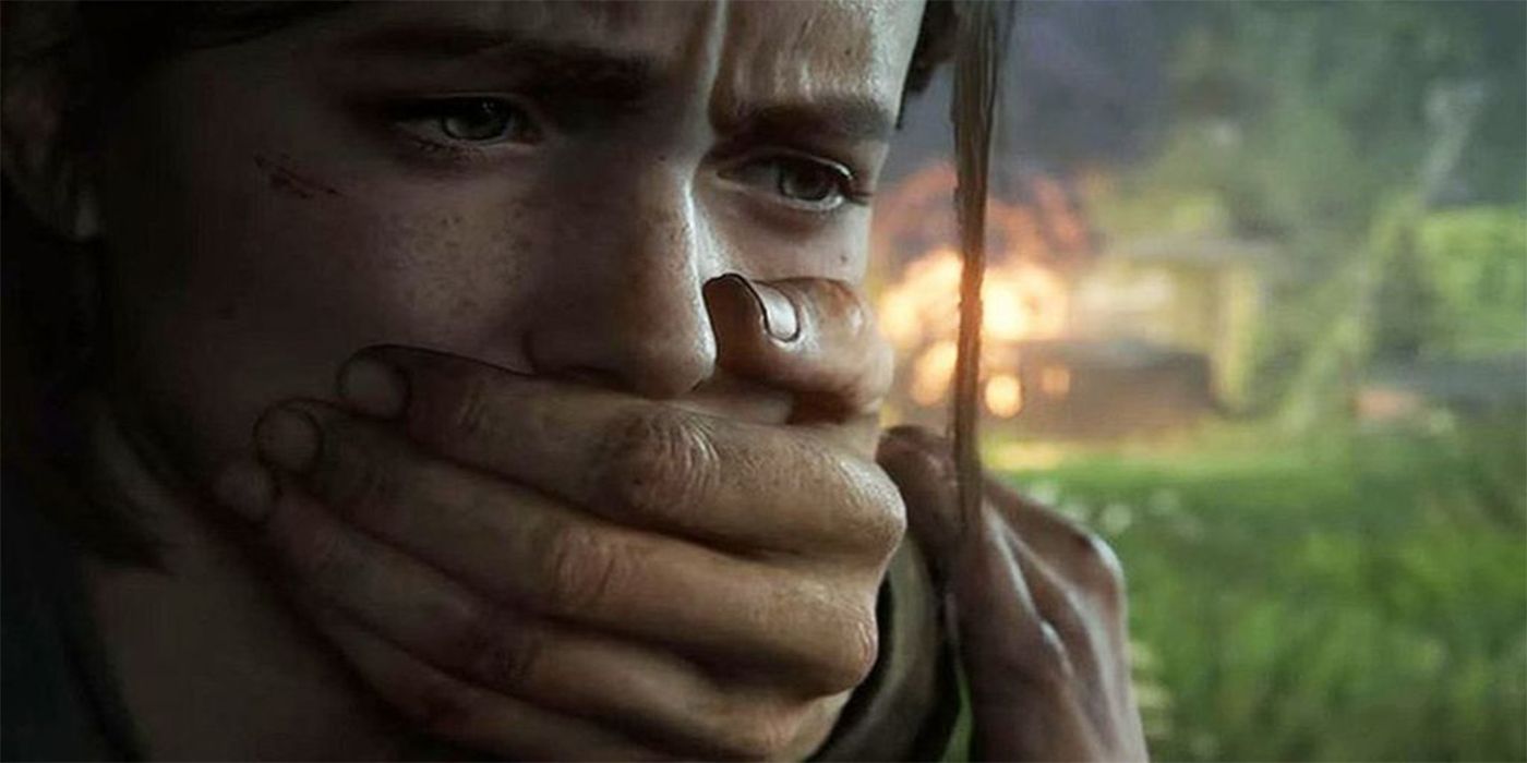 Ellie with hand over mouth