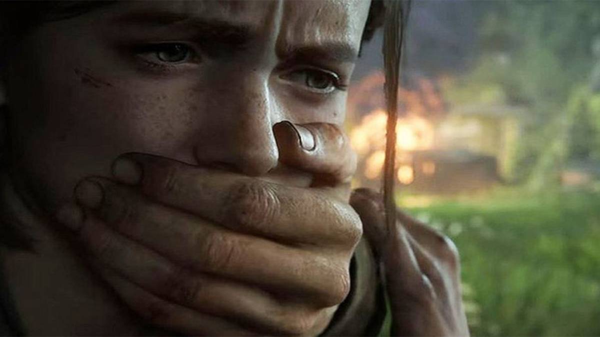 Ellie with hand over mouth