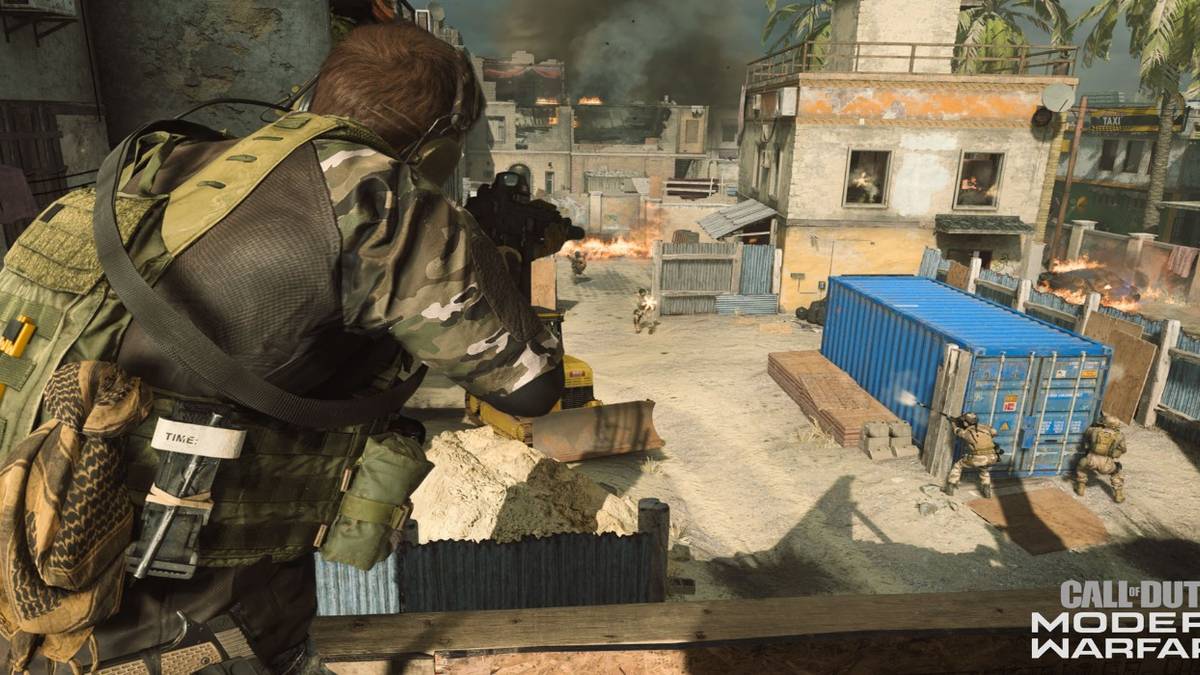 modern warfare player with rifle shooting on rooftop