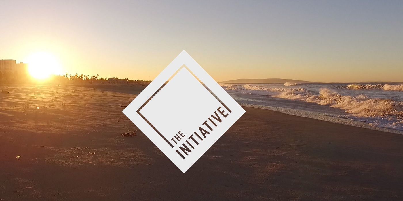 initiative logo over beach