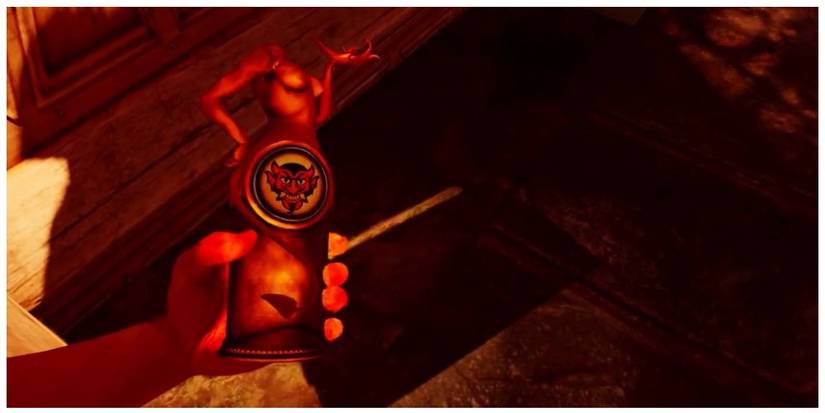 A player holding a bottle of Devil's Kiss