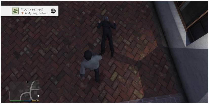 Franklin Clinton standing over a dead body