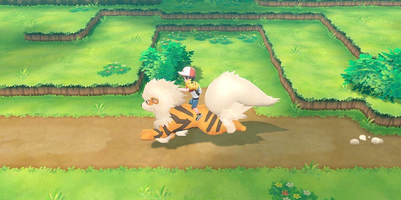Player riding a growlithe in Pokemon Let's Go!