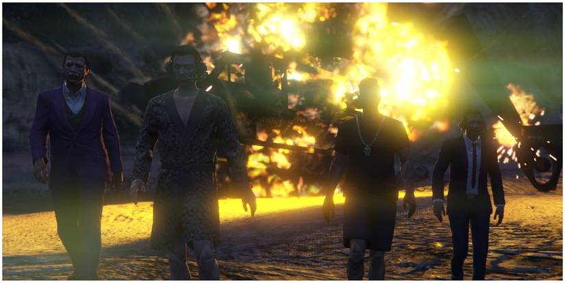 Players walking away from a blown up helicopter