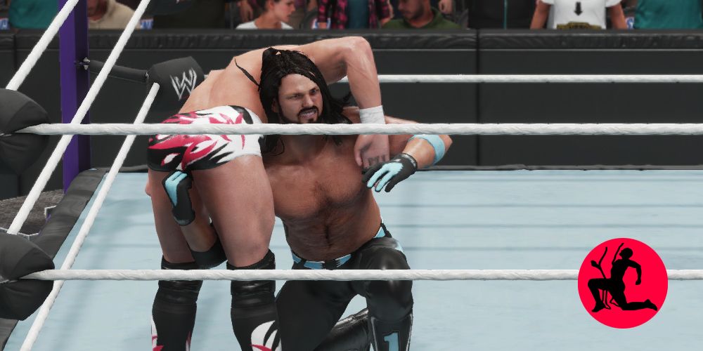 WWE-2K-Low-Blow-Payback AJ Styles low blow on Daniel Bryan