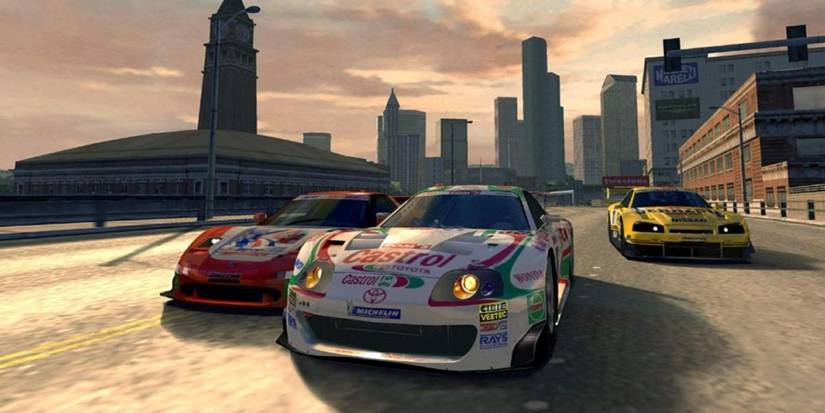 Cars racing in a city