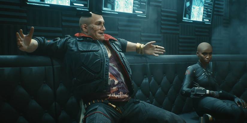 Jackie Welles sitting on a couch