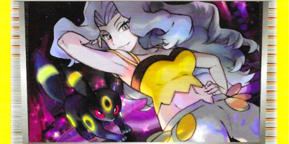 pokemon trainer card from the tcg featuring karen from the johto elite four with her umbreon