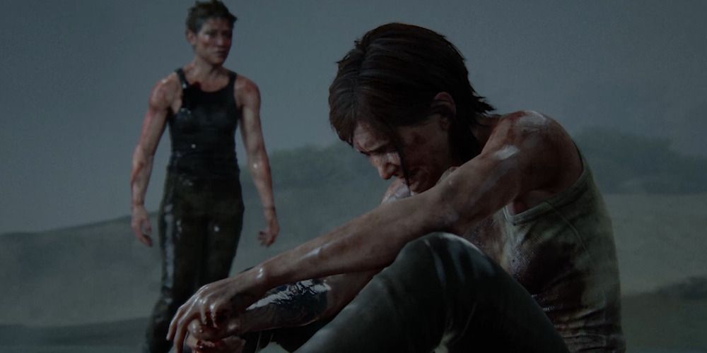 Abby looks on as Ellie breaks down crying in The Last of Us Part II