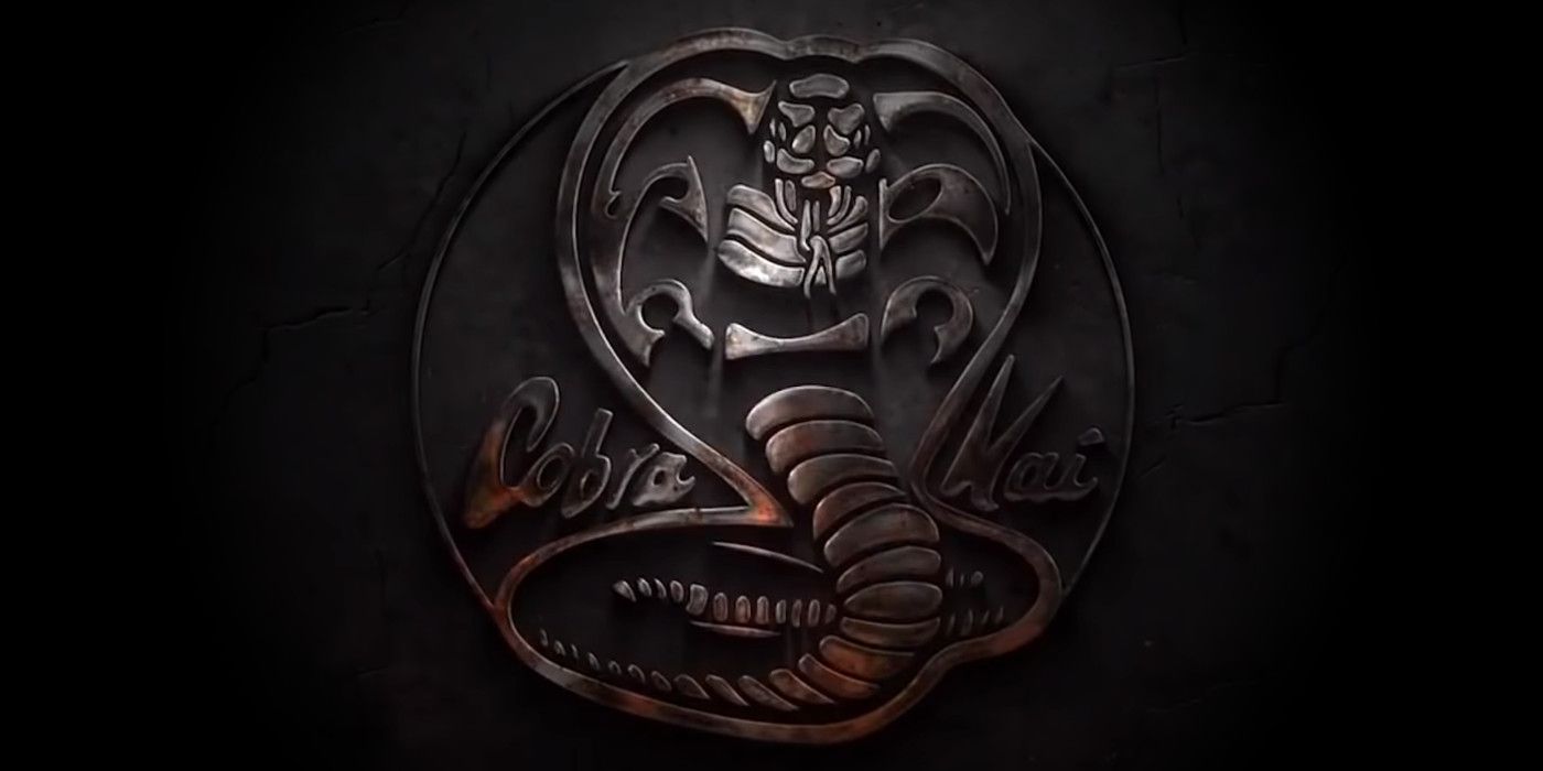 The Cobra Kai logo is a snake embossed in iron with its hood raised to strike.