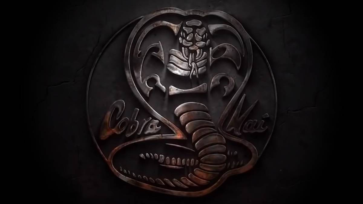 The Cobra Kai logo is a snake embossed in iron with its hood raised to strike.