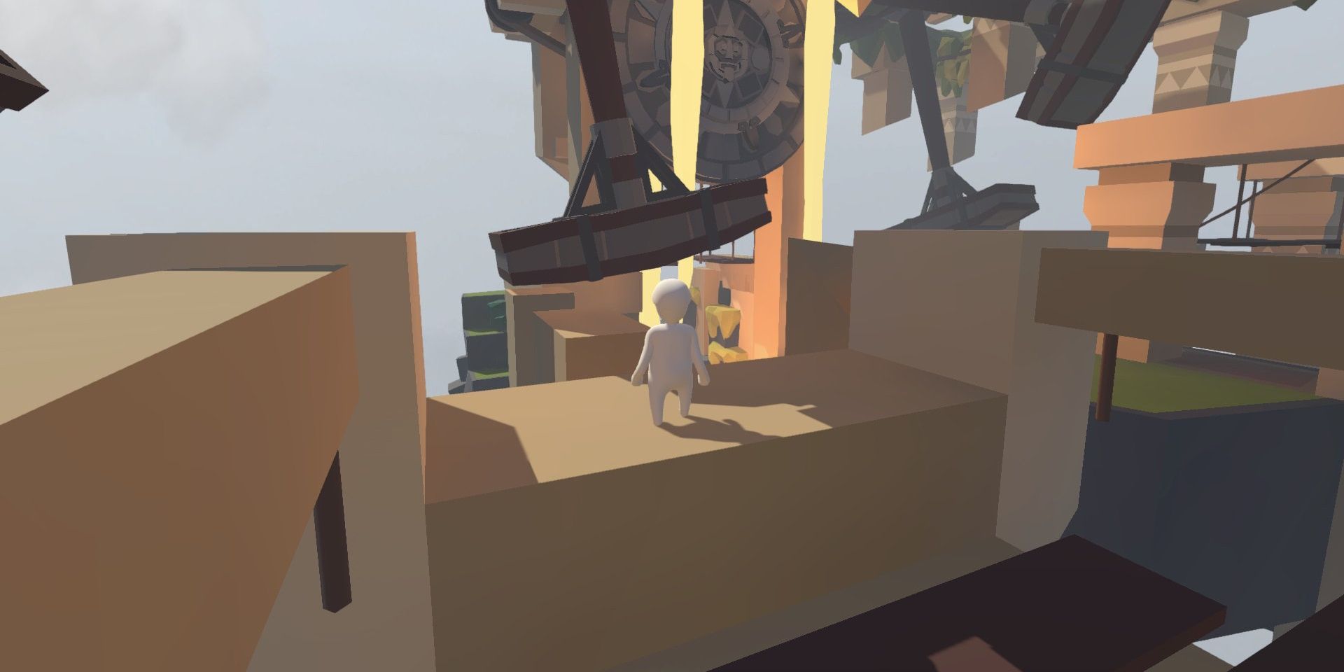 A player standing and waiting for an obstacle to pass in Human Fall Flat