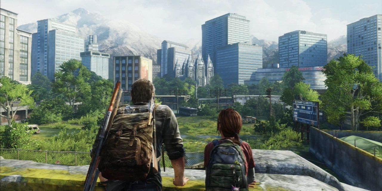 Joel and Ellie stand on a balcony overlooking the city filled with vegetation in The Last of Us
