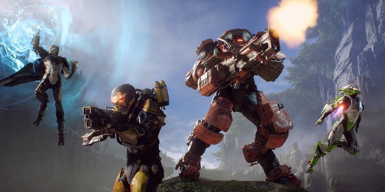 People in futuristic space suits stand together and shoot in Anthem Cropped