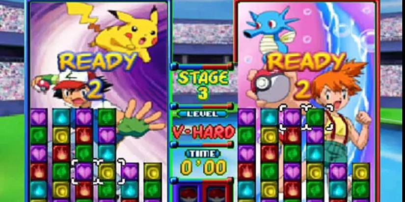 pokemon puzzle league Ash vs Misty with half-filled screen of colored blocks